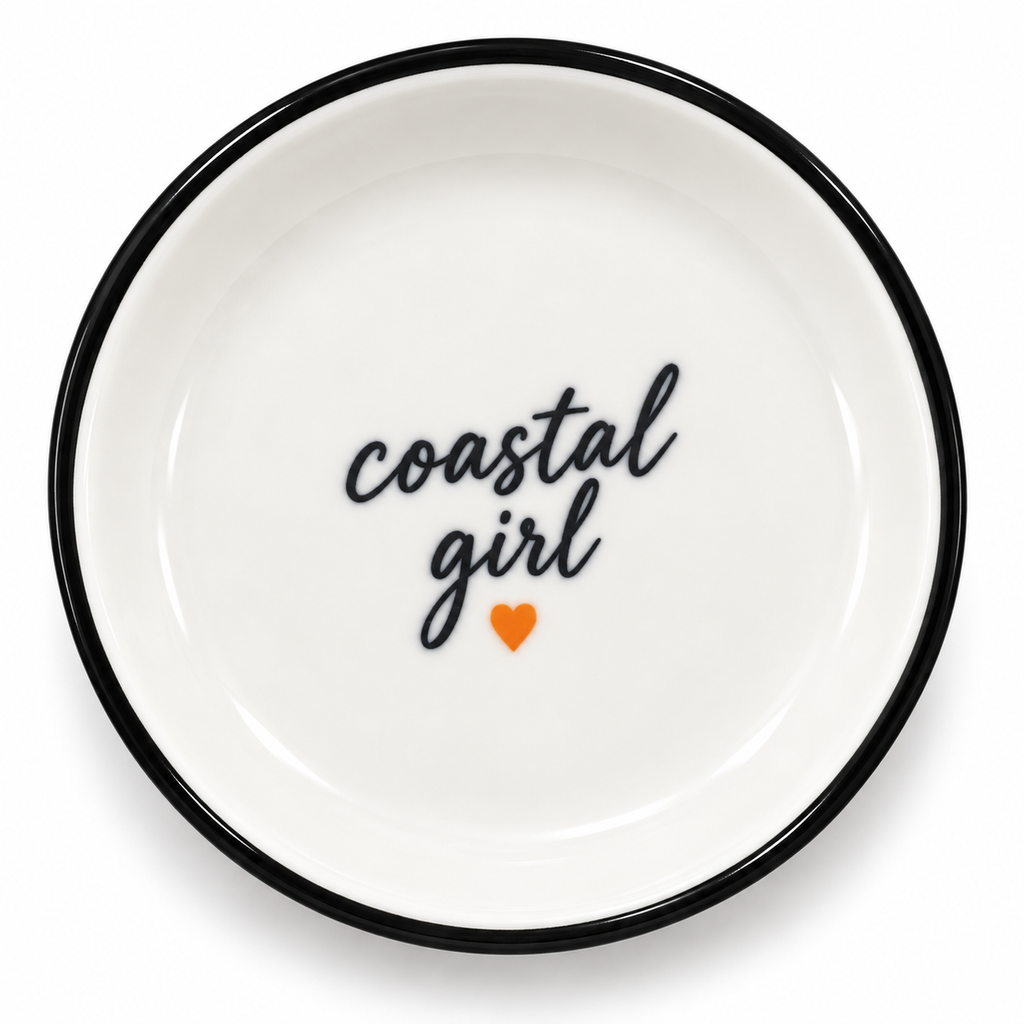 A sweet little 4 inch ceramic trinket tray inspired by West Coast days and made for life's small treasures. Finished with a black rim, handwritten coastal girl lettering , and a small coral heart. 

Perfect  for rings, earrings, keys or tiny keepsakes on  a bedside  table, bathroom counter or  desk.