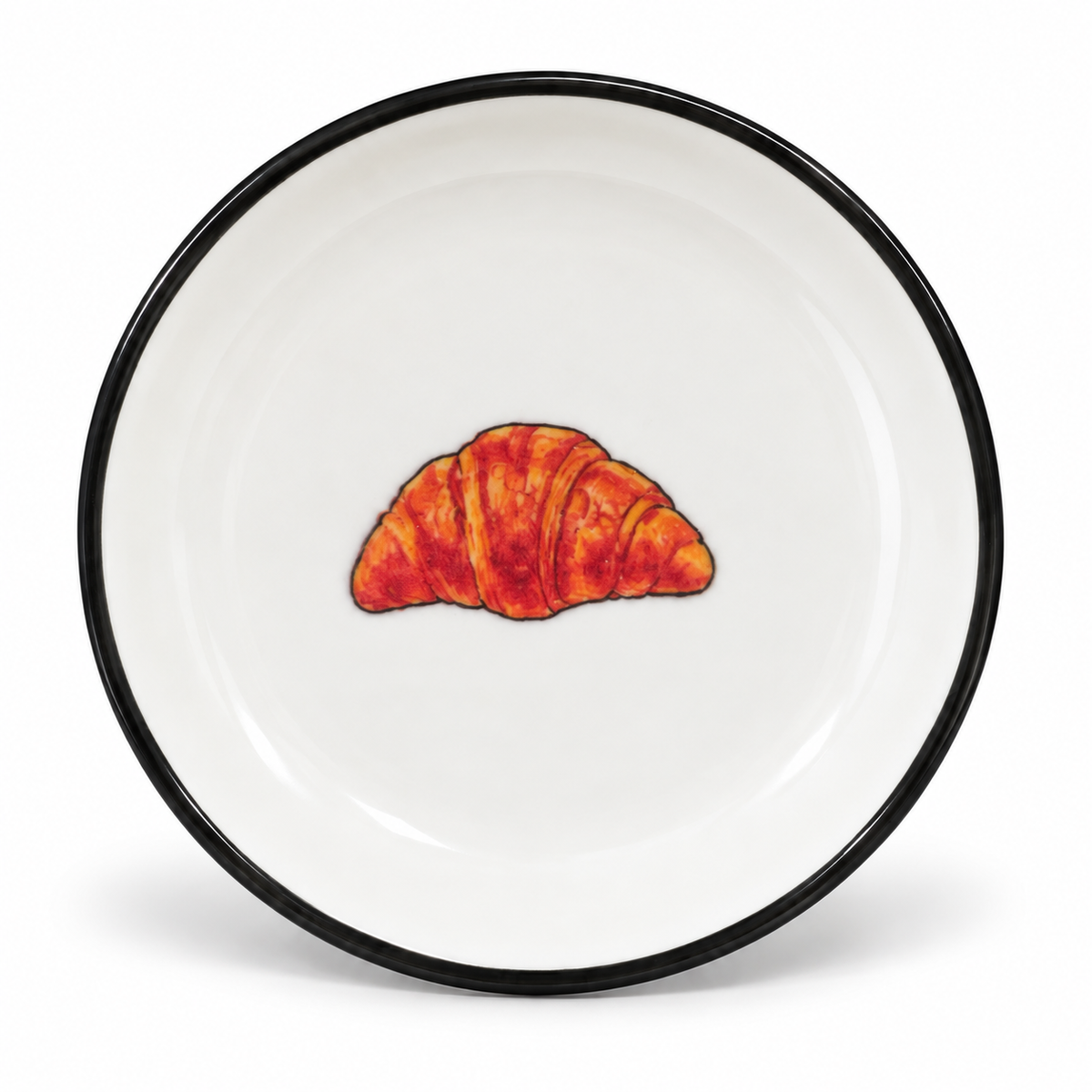 A little Parisian treat for your favourite things. This 4-inch ceramic trinket tray features a hand-painted croissant, finished with a classic black rim.

Perfect for rings, earrings, a favourite necklace, or the little treasures you want to keep close. A sweet detail for anyone who loves Paris, brunch, and beautiful little things.