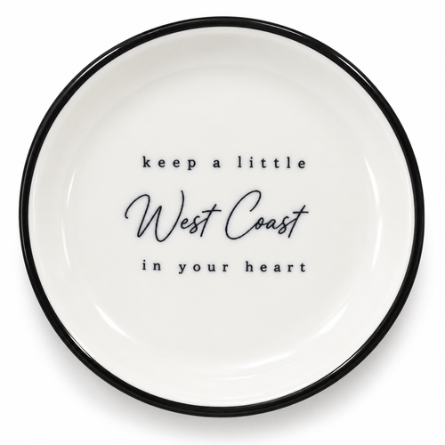 A little 4 inch ceramic trinket tray inspired by the place we a;ways carry with us - the West coast. Finished with a black rim and message keep a little West Coast in your heart. 

Perfect for rings, earrings, keys or tiny keepsakes. 